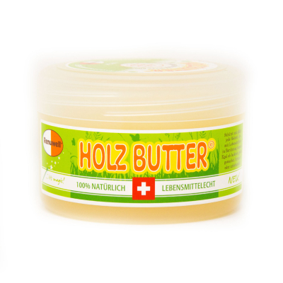 Eine Dose Holzbutter von der Seite.